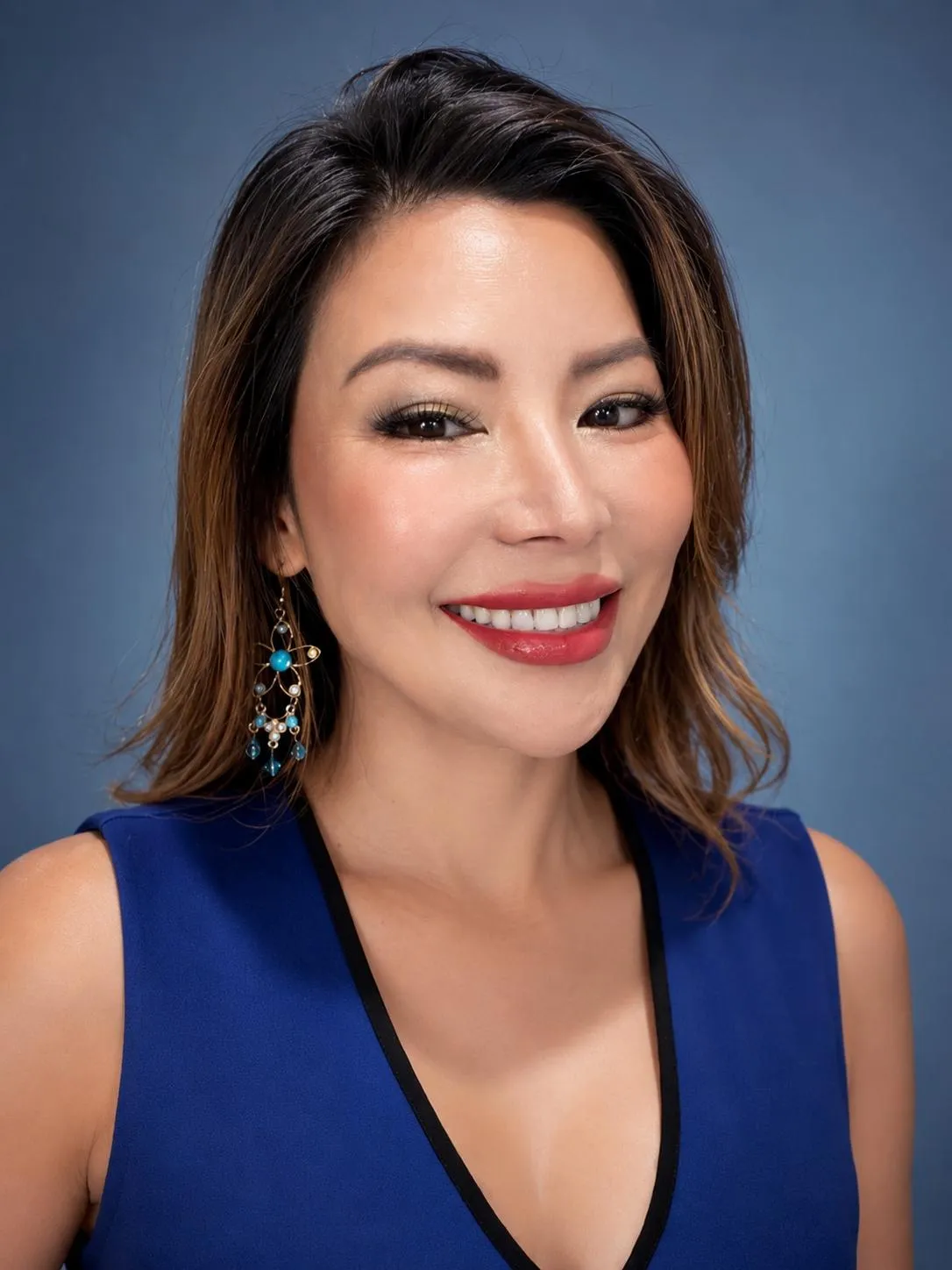 Sara Chau in a blue dress